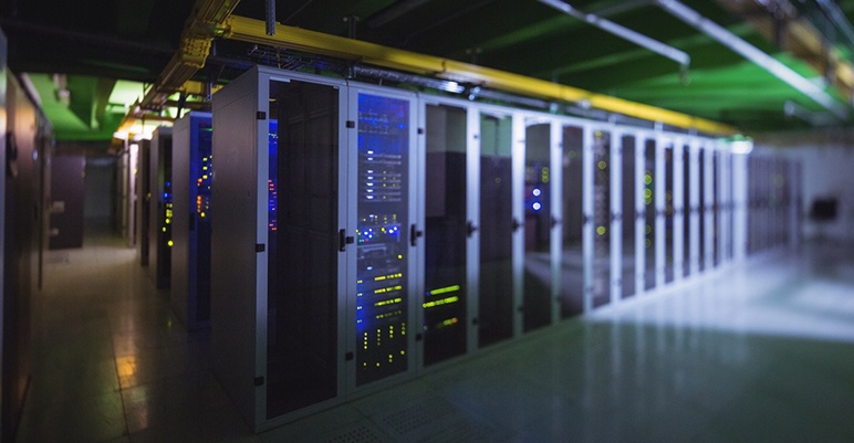 Hallway with a row of servers in server room